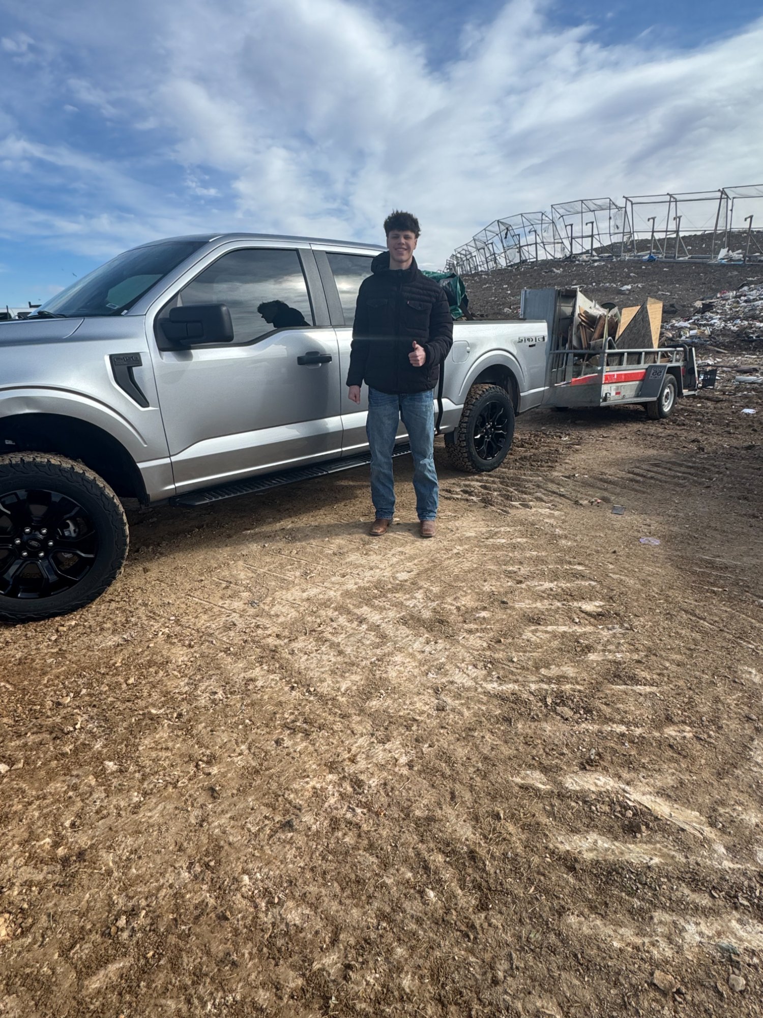 Sparks NoCo truck and trailer at the dump after junk removal
